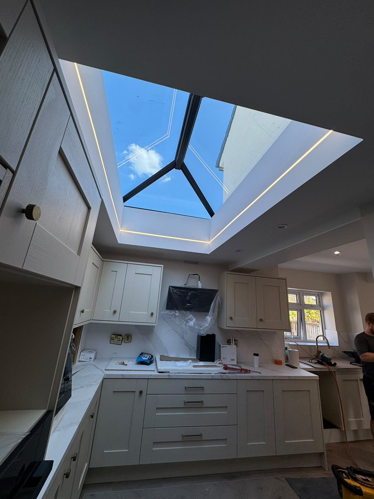 Kitchen with lantern rooflight and recessed LED lighting