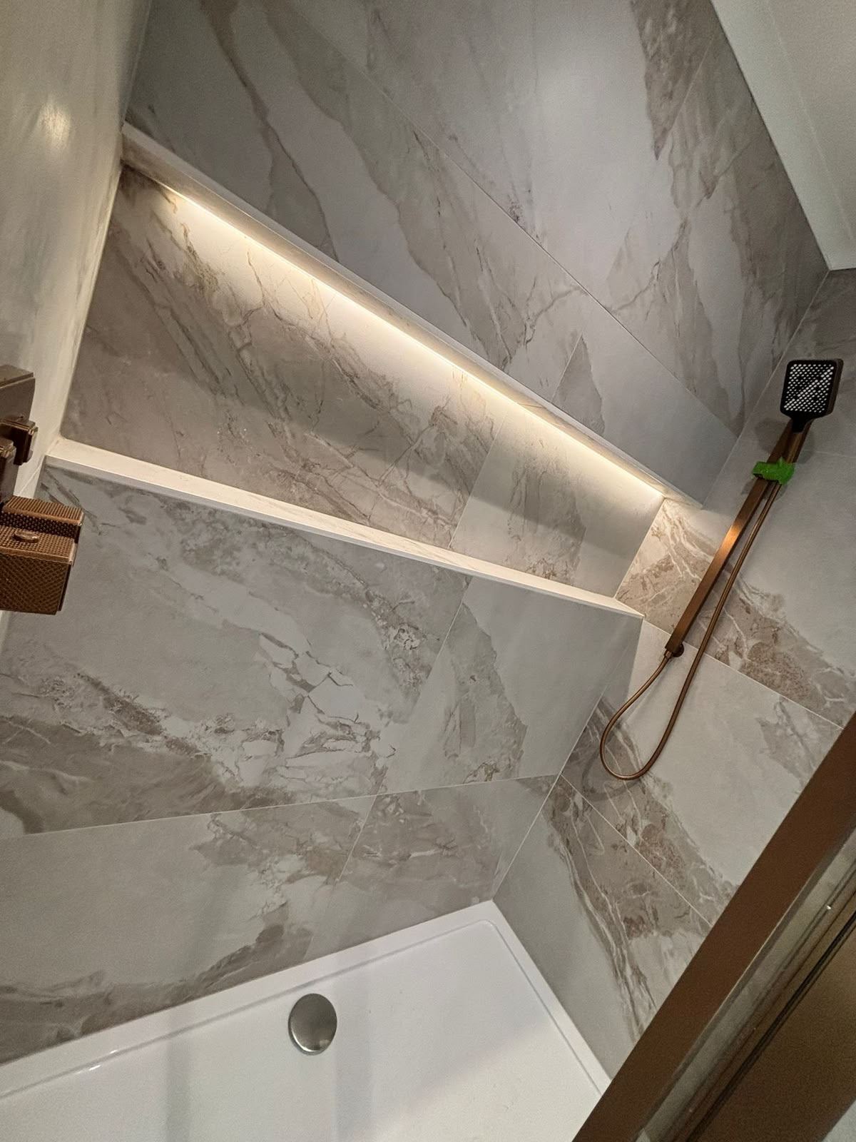 Bathroom feature wall with recessed LED strip lighting